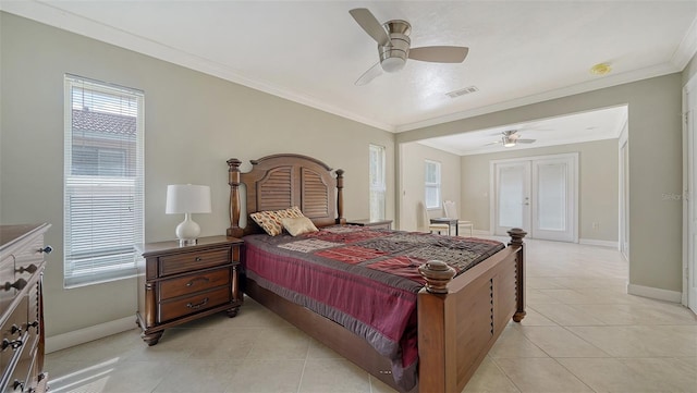 bedroom featuring ornamental molding, ceiling fan, and light tile patterned floors