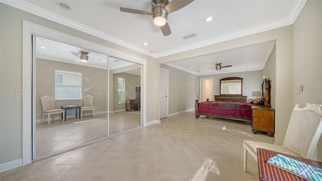 tiled bedroom with ornamental molding and ceiling fan