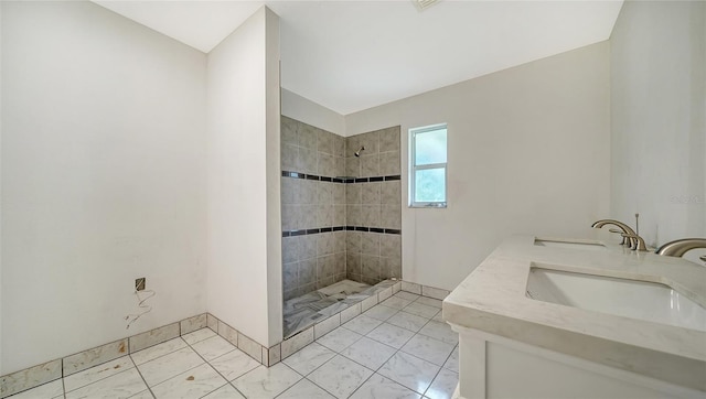 134 Da Vinci Dr, Nokomis, FL 34275 - bathroom featuring tiled shower, marble finish flooring, and double vanity
