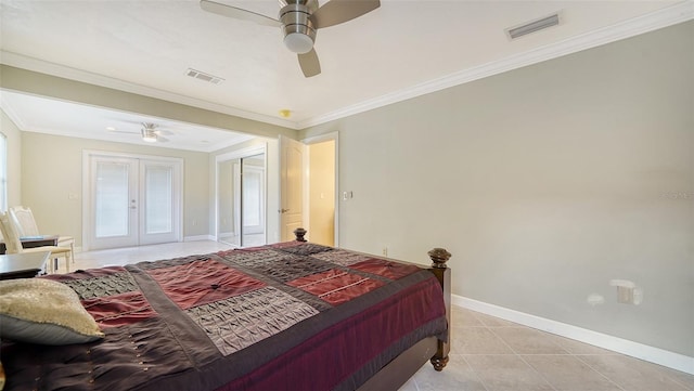 tiled bedroom featuring ceiling fan, french doors, and ornamental molding