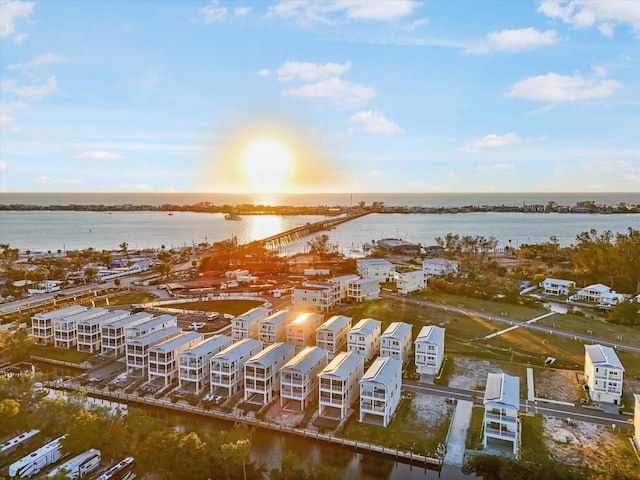 aerial view at dusk with a water view