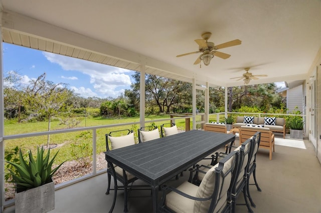 view of patio / terrace with outdoor dining area, a ceiling fan, and an outdoor living space
