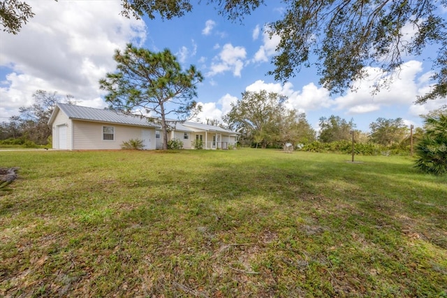 view of yard featuring a garage