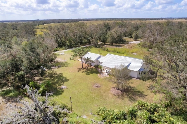 birds eye view of property featuring a rural view and a view of trees