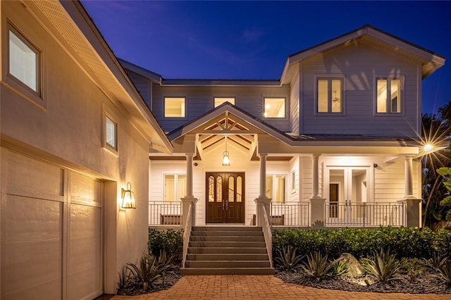 exterior entry at twilight with french doors