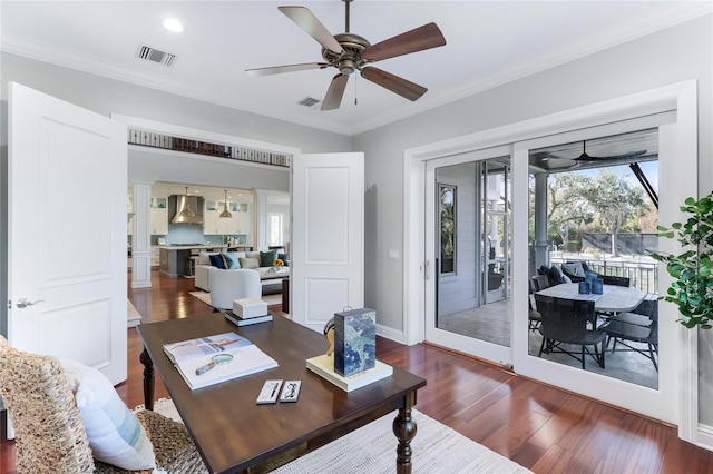 office with ceiling fan, dark hardwood / wood-style flooring, and crown molding