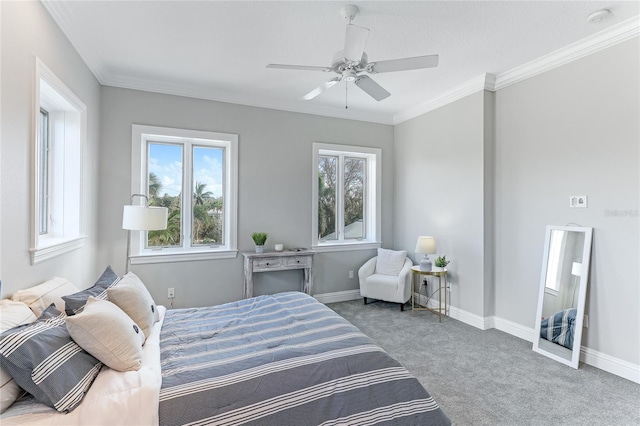 carpeted bedroom with ceiling fan and crown molding