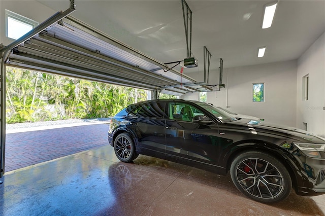 garage featuring a garage door opener