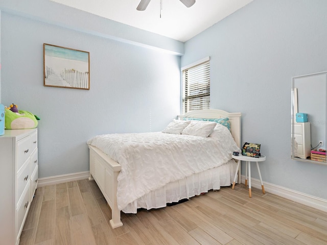 bedroom with ceiling fan and light hardwood / wood-style floors