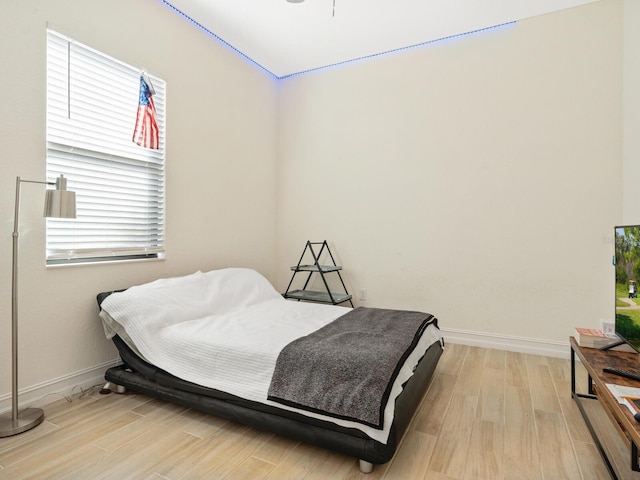 bedroom with light hardwood / wood-style flooring