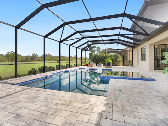 view of pool with a patio area, an in ground hot tub, and glass enclosure