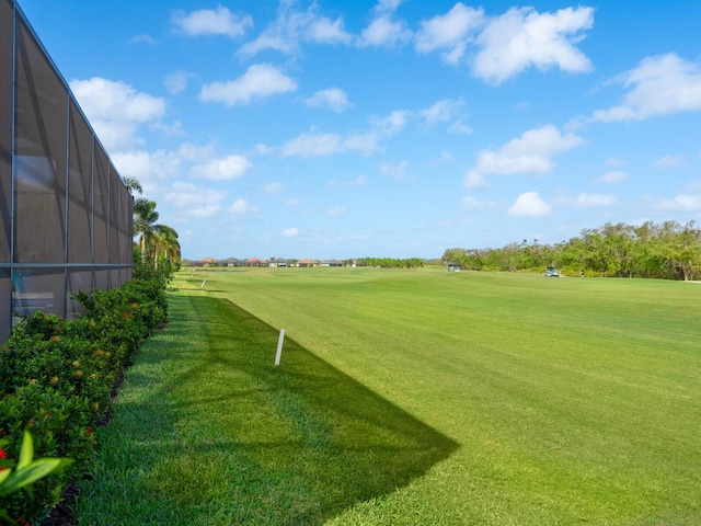 view of property's community with a yard