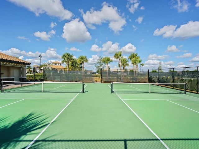 view of tennis court featuring basketball court