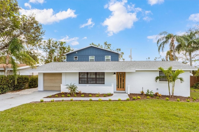 view of front of home with a garage and a front yard