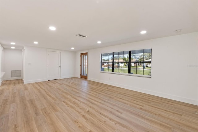 spare room featuring light wood-type flooring