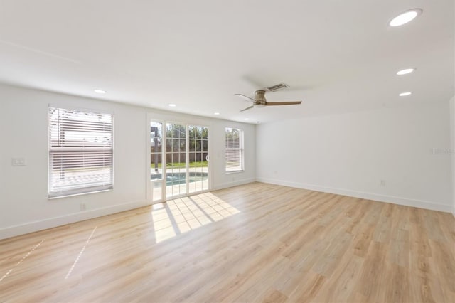 empty room with light hardwood / wood-style floors and ceiling fan