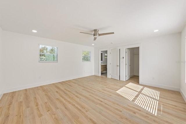 unfurnished room featuring light hardwood / wood-style flooring and ceiling fan