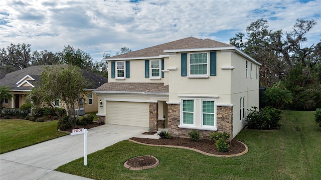 view of front of house featuring a front lawn and a garage