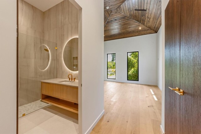 bathroom with walk in shower, vanity, hardwood / wood-style flooring, and wooden ceiling