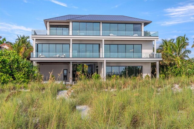 back of property with a balcony