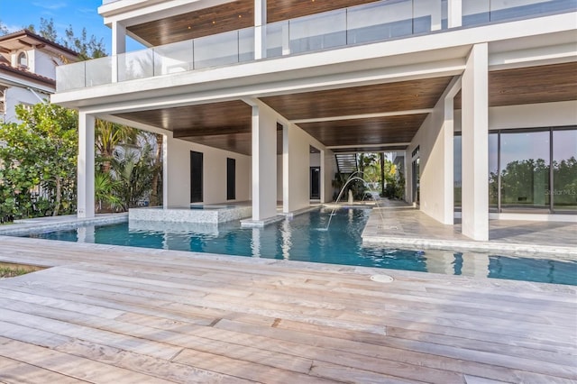 view of pool featuring a patio and pool water feature