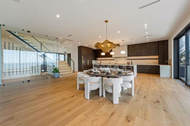 dining area featuring a healthy amount of sunlight and light wood-type flooring