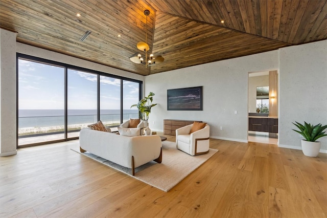 living room with wooden ceiling, a water view, high vaulted ceiling, and light hardwood / wood-style flooring