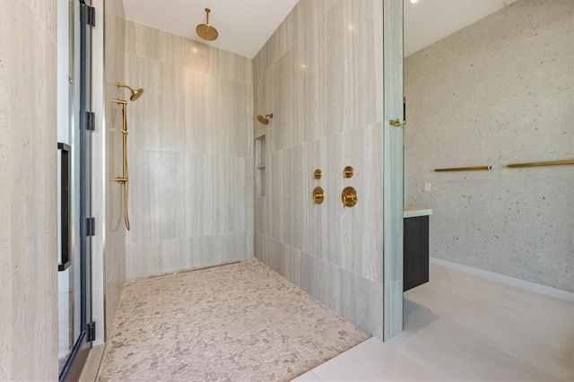 bathroom with a tile shower