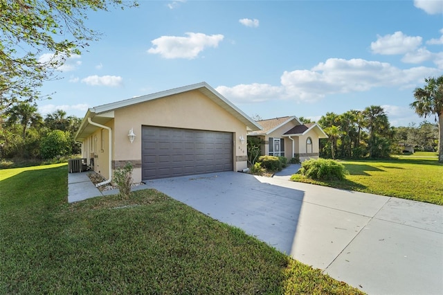 ranch-style house with a garage, central air condition unit, and a front yard