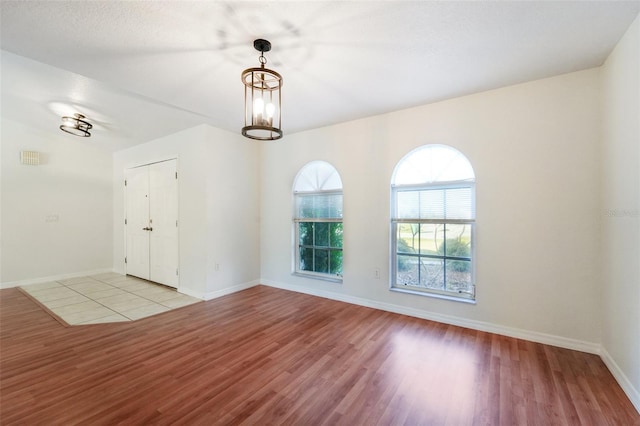 unfurnished room featuring light wood-type flooring