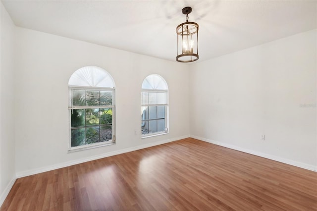 empty room with hardwood / wood-style flooring