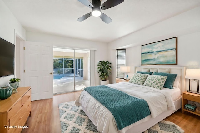 bedroom with ceiling fan, light hardwood / wood-style flooring, and access to outside