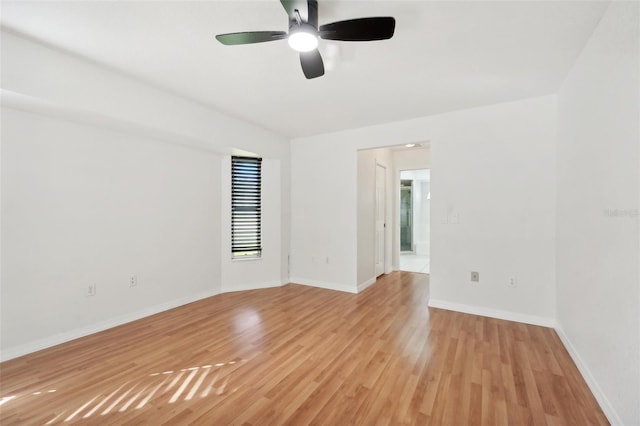 spare room with ceiling fan and light hardwood / wood-style flooring