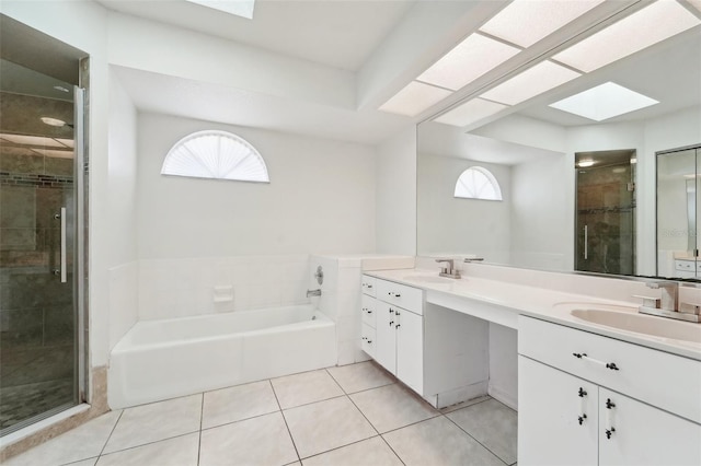 bathroom featuring vanity, plenty of natural light, and a skylight