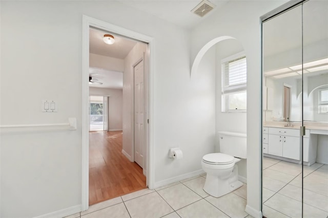 bathroom featuring toilet, vanity, and hardwood / wood-style flooring