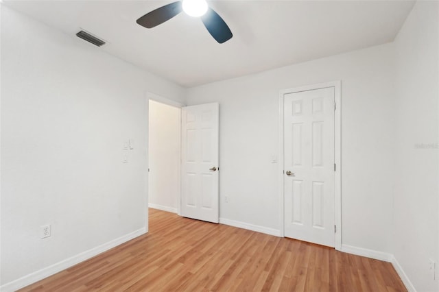 unfurnished bedroom with ceiling fan and light hardwood / wood-style flooring