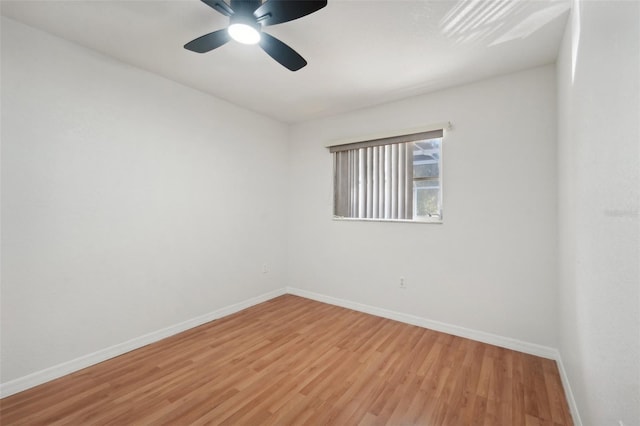 unfurnished room with ceiling fan and wood-type flooring