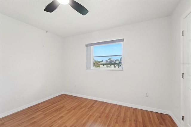 spare room featuring light hardwood / wood-style floors and ceiling fan