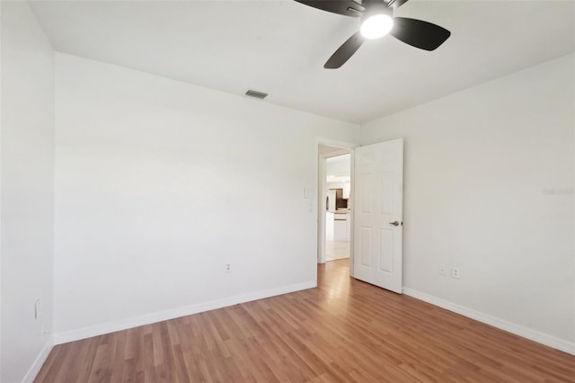 unfurnished room featuring light hardwood / wood-style flooring and ceiling fan