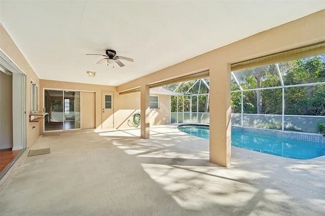 view of swimming pool featuring ceiling fan