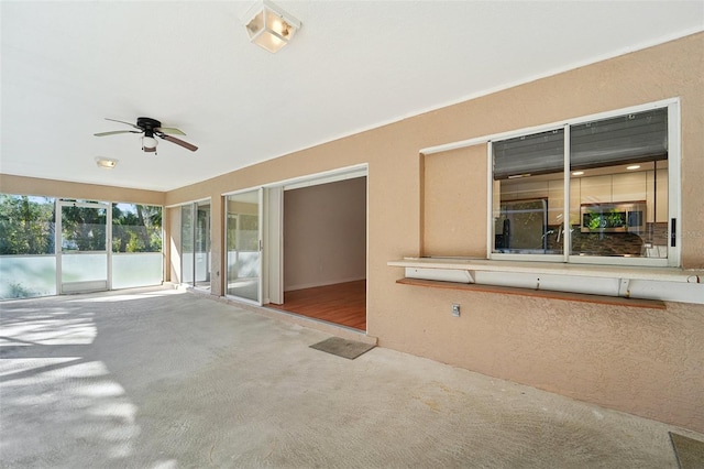 view of patio / terrace featuring ceiling fan