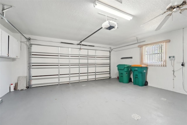 garage featuring a garage door opener and ceiling fan