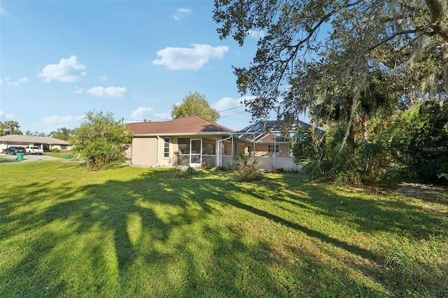 view of yard featuring a sunroom