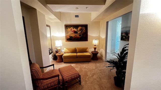 living area featuring light colored carpet