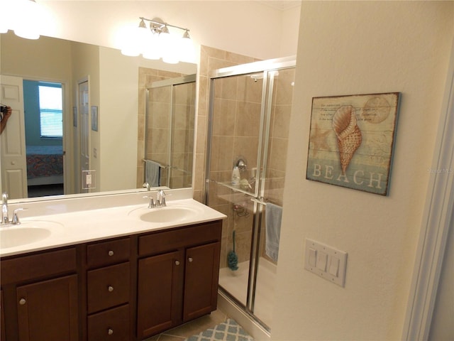 bathroom featuring vanity and an enclosed shower