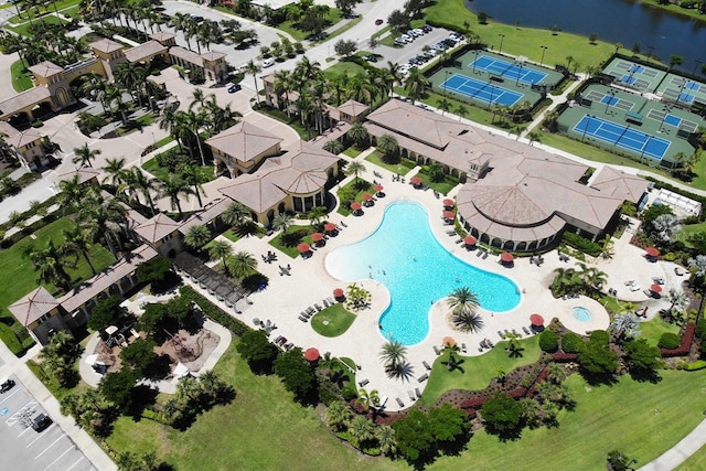 birds eye view of property with a water view