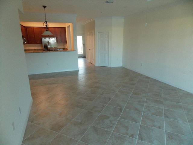 unfurnished living room with light tile patterned flooring