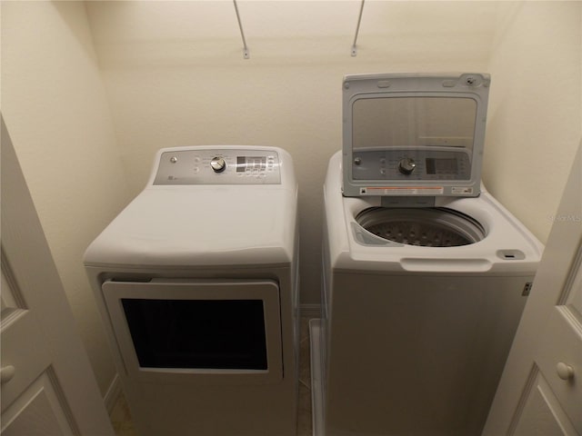 laundry room with independent washer and dryer