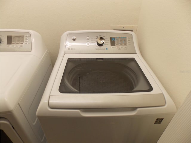 laundry area with washer and clothes dryer