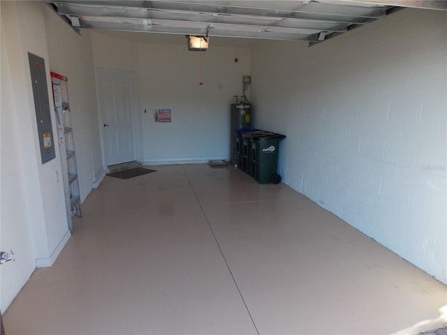 garage with electric water heater and a garage door opener